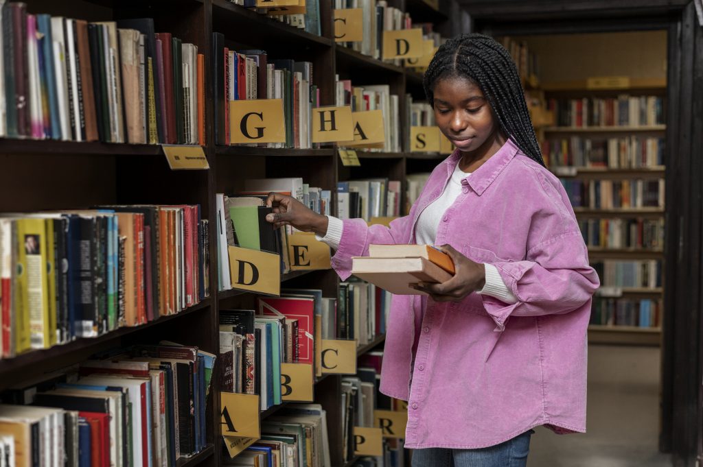 A young girl checking for books of interest